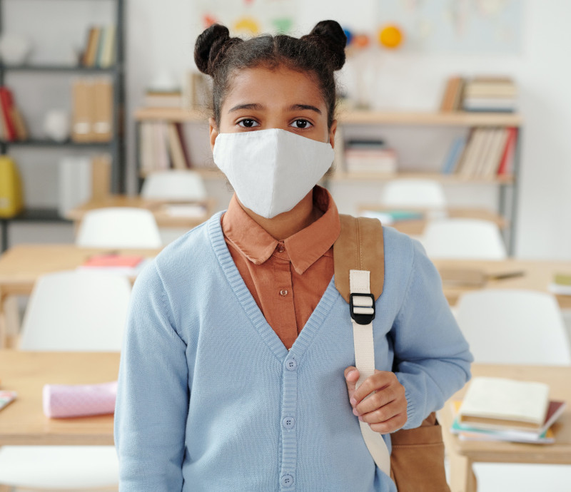 A school child wearing a face mask